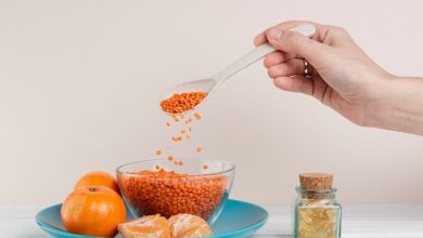 close-up-man-pouring-seeds-with-spoon_23-2148427692-2251328